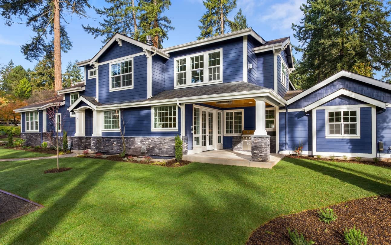 Navy Blue Exterior Residential House Navy blue exterior residential house with white trim, stone foundation, and multiple gabled rooflines in Atlanta, GA