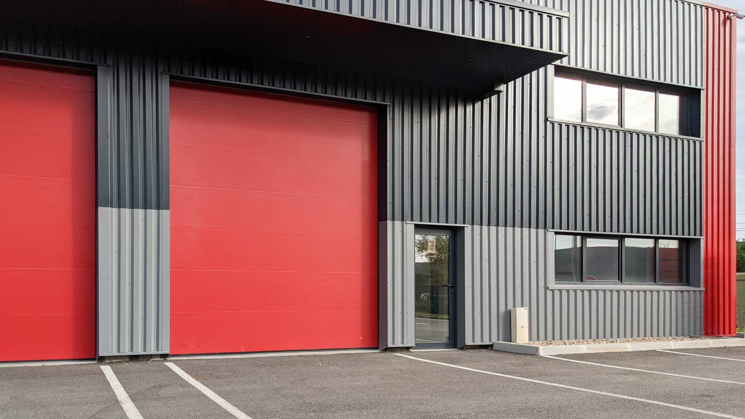 modern industrial unit with two red roller doors modern industrial unit