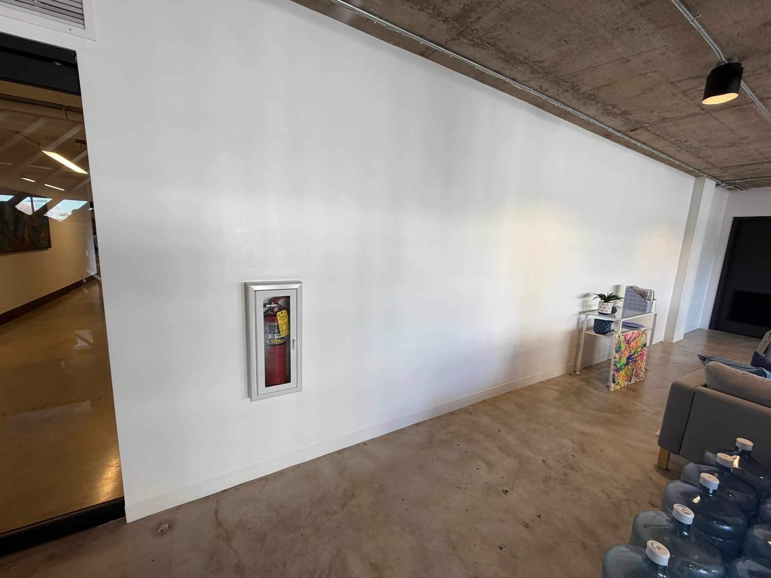 White Commercial Interior Wall Freshly painted bright white commercial interior wall with concrete floor and exposed ceiling in Atlanta, GA.